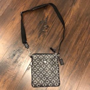 Coach crossbody 7x8x1. Black/white logo and purple inside. Like New. Authentic